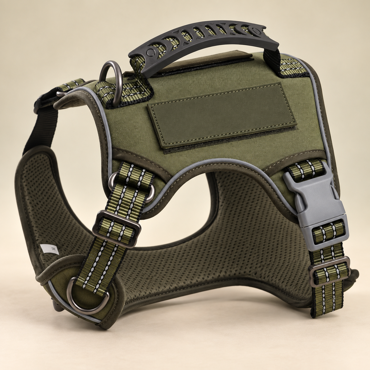 Green Pawblefy tactical harness showing the control handle, padded lining, adjustable straps and leash attachment hardware